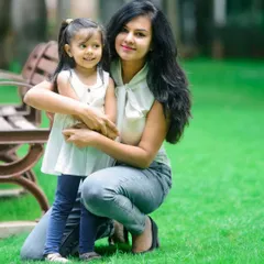 A sweet portrait of a mother holding her young daughter. This image captures the gentle and protective bond between a mother and her child.