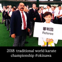 Serving as a referee at the 2018 Traditional World Karate Championship in Okinawa. Participating in global events ensures our standards remain at the highest level.
