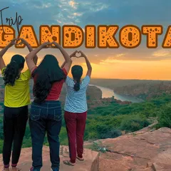 A fun and creative group pose at the edge of the Gandikota canyon during sunset.