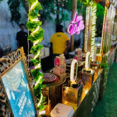 The beautifully decorated waffle counter, adorned with greenery and lights, creating an inviting dessert destination.