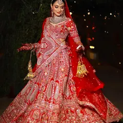 My beautiful bride Nitu, twirling in her gorgeous red lehenga. I gave her a classic look with bold red lips that was perfect for her big day.