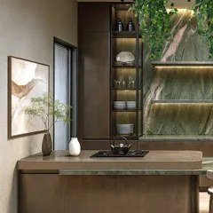 The kitchen island features an integrated cooktop and a breakfast counter, making it a multi-functional hub for cooking and socializing. The design is both practical and elegant.