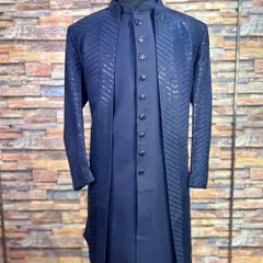 Experience timeless elegance with our navy blue Lakhnavi sherwani. This three-piece set features a shimmering chevron pattern on the jacket, layered over a matching kurta, offering a sophisticated look for a groom or wedding guest.