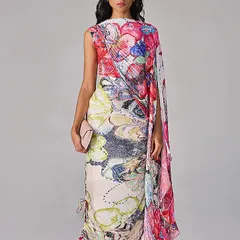 A wearable canvas. This draped dress features a vibrant, abstract floral print, transforming a simple silhouette into a piece of art.