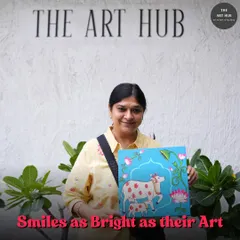 The smiles on my students' faces are as bright as their art. This student is proudly holding her completed Pichwai-style painting, a beautiful piece created right here in the studio.