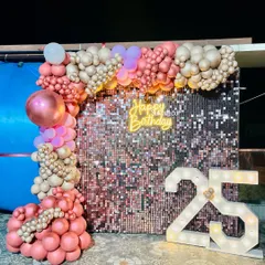 An alternate angle of the 25th birthday decor, showing how the shimmer wall beautifully reflects the light.