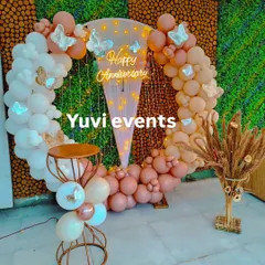 A whimsical anniversary backdrop featuring a circular balloon arch in pastel pinks and whites. I added butterfly cutouts and a 'Happy Anniversary' neon sign to create a soft, romantic theme for the celebration.