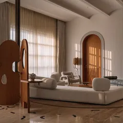 A wider view of the 'Japanese Jazz' junior master suite, showing the open-plan layout with the Hide and Seek screen, custom chaise lounge, and a large, comfortable bed.