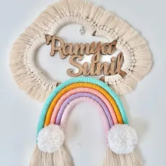 A lovely custom name hanging for Ramya and Sunil in soft pastel rainbow colors. The natural wood lettering adds a beautiful, rustic touch against the macrame cloud.