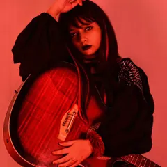 This is the power of styling. A glimpse into my portfolio showing a punk-inspired look with a black top, fishnet stockings, and dark makeup. It's all about creating a character and telling a story through fashion.