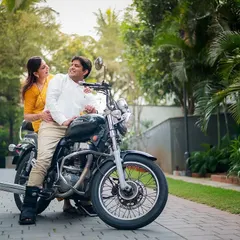 A cool and casual shot of a couple on a motorcycle, perfect for an anniversary or pre-wedding shoot that shows off your personality.