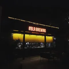The neon sign of BLR Brewing Co. lights up the night, welcoming you to an evening of fresh brews, bold food, and great music. It's a landmark for good times.