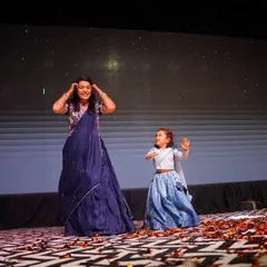 A beautiful, candid moment from a wedding sangeet we choreographed. It's pure joy to see family members of all ages, like this mother and daughter, sharing a dance on stage.