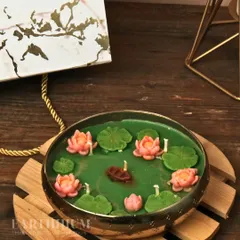 A different angle of the Lotus Pond candle, showing the tiny boat detail that adds a touch of whimsy.