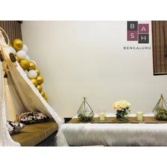 A closer look at the details inside our teepee tent setup. The combination of gold and white balloons, a dreamcatcher accent, and soft pillows creates a space that feels both luxurious and comfortable.