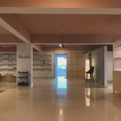 Another perspective of our studio, showing the clean lines and thoughtful layout. Every detail, from the lighting to the polished floors, was chosen to create a peaceful and professional environment for our artists.