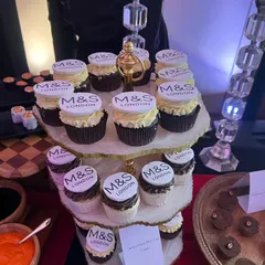 A tower of custom-branded cupcakes for the Marks & Spencer flagship store launch. These desserts not only taste great but also serve as a powerful branding tool for corporate events.