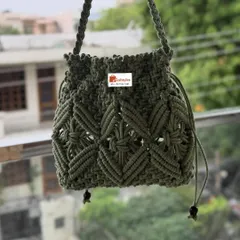 This olive green potli bag has such a unique and intricate design. It's perfect for carrying your essentials during a wedding or festival.