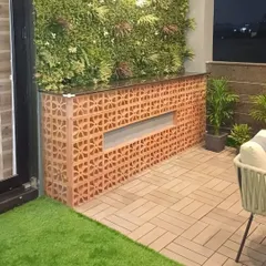A recently completed terrace project. This features a custom-built bar counter with terracotta jali work, a vertical garden, and durable outdoor deck flooring. Happy clients are what we truly earn.