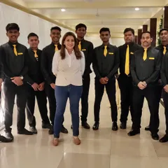 Our founder, Zia, with her incredible team. We are a close-knit group of hospitality professionals who are passionate about what we do and dedicated to our clients.