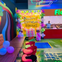 A wider view of the cafe setup, showing how the decoration fits into the vibrant and modern interior of the venue.