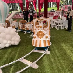 The Fun Express train ready to depart at an outdoor party. Our staff is always on hand to ensure the safe operation of the ride.