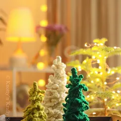 A quiet Christmas corner in my home. These little crochet trees in different shades of green and cream add a touch of handmade warmth to the festive glow.