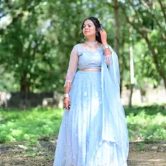 A client looking lovely in a powder blue lehenga. This is a great rental option for a daytime event or a pre-wedding function, with its light color and delicate embroidery.