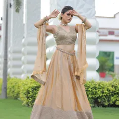This stunning golden lehenga is a perfect example of our custom work, ideal for a unique bridal or pre-wedding shoot look.