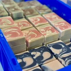 Another shot of our colorful soap collection, showing the beautiful swirls and layers that make each variety unique.