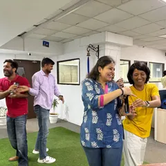 Yoga is a powerful tool for team bonding. In this moment of shared laughter and lightheartedness during a session, you can see how practicing together helps build connection and a positive, supportive atmosphere within the team.