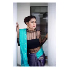 A tighter frame from the same series, focusing on the model's expression and the beautiful contrast between the sheer black top and the vibrant turquoise and purple silk. This is a great shot for showcasing jewelry and makeup details.