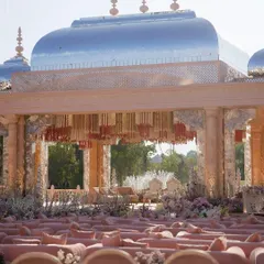 The palatial setup for the Adani wedding, with its silver dome and blush-toned seating. This demonstrates our ability to manage and execute events of significant scale, creating a regal environment that leaves a lasting impression.