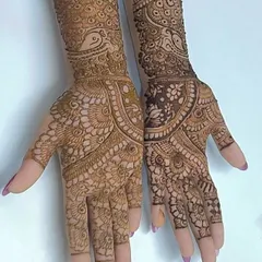This is the 'after' photo of a student's work, showing beautifully executed Indian mehndi with clean lines and balanced composition, a huge improvement from where they started.