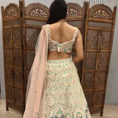 A detailed look at the stunning open-back design of the blouse.