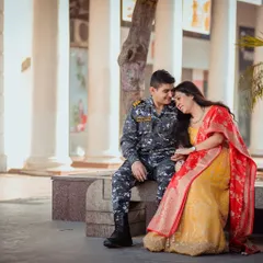 I love incorporating personal elements into pre-wedding shoots. Here, we highlighted the groom's naval uniform in a relaxed, romantic setting at Connaught Place. The contrast between his formal attire and her vibrant traditional outfit creates a visually compelling story about their lives coming together.