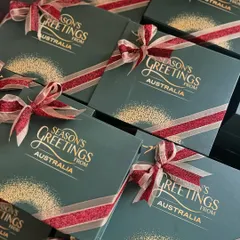 The finished Christmas boxes for the Australian Consulate, all tied up with a festive red and gold ribbon. The gold foil lettering on the green box looks so elegant.