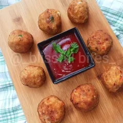 These golden-brown Chicken Cheese Shots are a perfect party starter or tea-time snack. Served hot with a side of ketchup, these bite-sized treats are crispy on the outside and filled with gooey melted cheese and savory chicken.