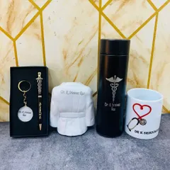 This doctor-themed combo set includes a personalized temperature bottle, a doctor pen and keychain set, a unique doctor's coat pen stand, and a custom mug.