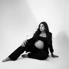 A relaxed and confident pose on the floor. The use of shadow and light in this black and white image is just beautiful.