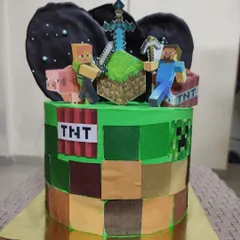 I love bringing your favorite worlds to life, like with this custom Minecraft theme cake. The design features edible block textures and non-edible character toppers to create a centerpiece perfect for any gamer's birthday.