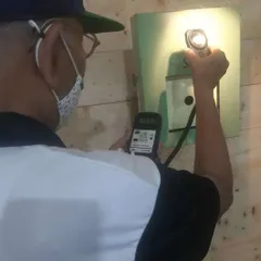 Attention to detail is critical. I personally use a lux meter to check that the lighting on every single target is consistent and compliant with ISSF rules for a fair match.