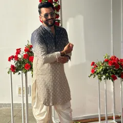 A smiling pose in my designer kurta. My look is always a mix of traditional and modern, which reflects my sangeet choreography style.