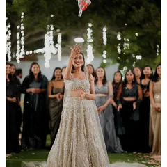 The bride tosses her bouquet during the reception, a fun tradition shared with friends and family on our spacious lawns.