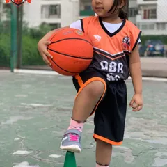 This young athlete is learning balance and coordination by practicing with a cone, a fundamental step in our youth training program.