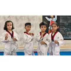 A group of our youngest students ready for class. They are learning the importance of focus and discipline in a fun environment.