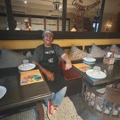 This is me in my happy place, laughing with guests after a satisfying meal. My pop-ups feel like a big family gathering, full of chatter and good vibes. This picture from my event in Mumbai captures that feeling perfectly.