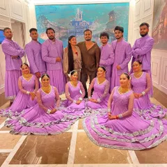A moment with my incredible team after a fantastic show. Dressed in coordinated lavender outfits, this picture captures the unity and professionalism of our artists.