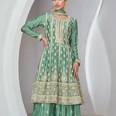This green Chinon silk palazzo suit is all about sophisticated charm. The top has heavy thread embroidery, and the flowy palazzo pants make it super comfortable yet dressy.