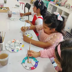 A table of girls painting their own Diwali-themed wall hangings. It was a session full of fun, chatter, and yummy snacks!